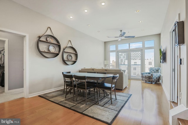 dining space featuring a ceiling fan, recessed lighting, baseboards, and light wood finished floors