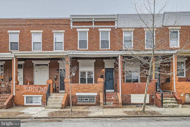 view of property featuring brick siding