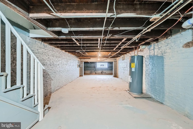 basement with water heater and brick wall