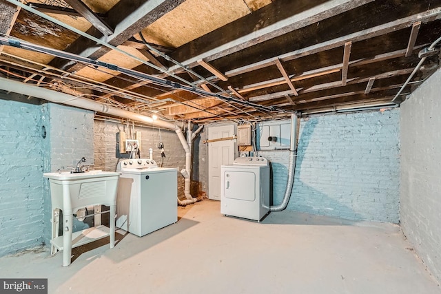 unfinished below grade area featuring separate washer and dryer