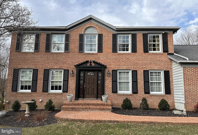 view of front of home featuring brick siding