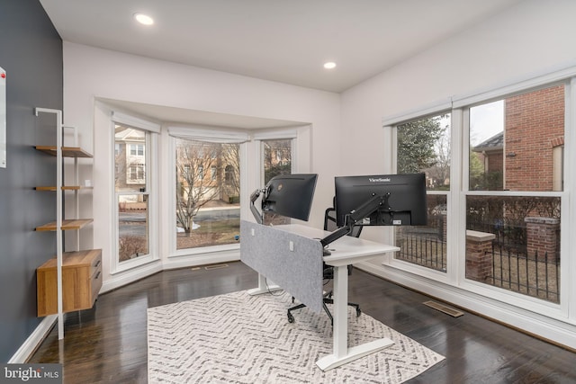 office with dark wood-style floors, recessed lighting, visible vents, and baseboards