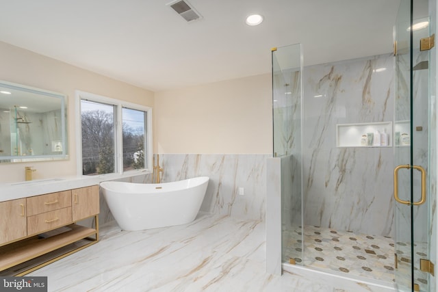 full bathroom with marble finish floor, vanity, a marble finish shower, and visible vents