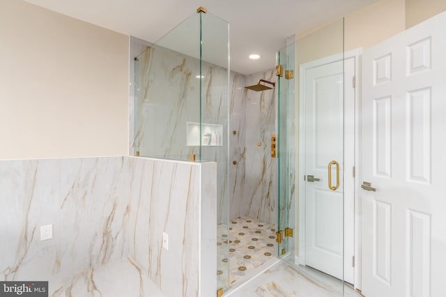 full bathroom with marble finish floor and a marble finish shower