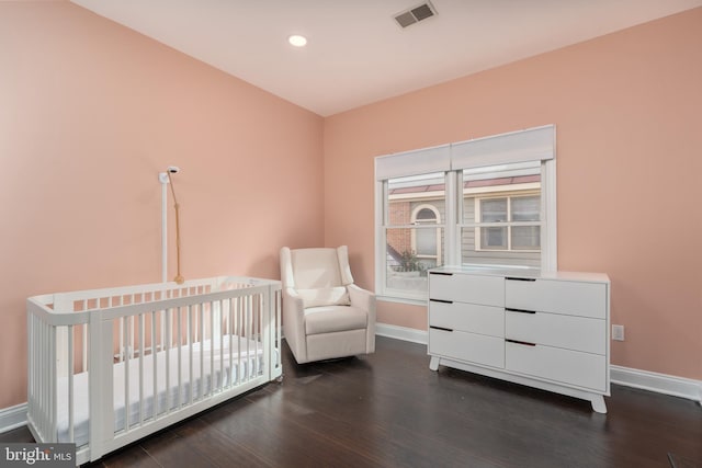 unfurnished bedroom with dark wood-type flooring, recessed lighting, visible vents, and baseboards