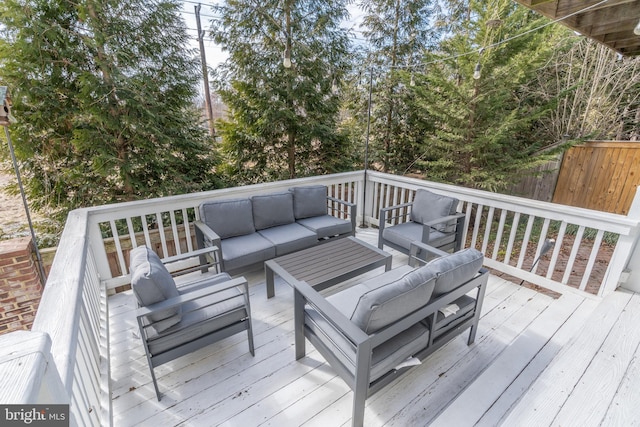 deck with fence and an outdoor hangout area