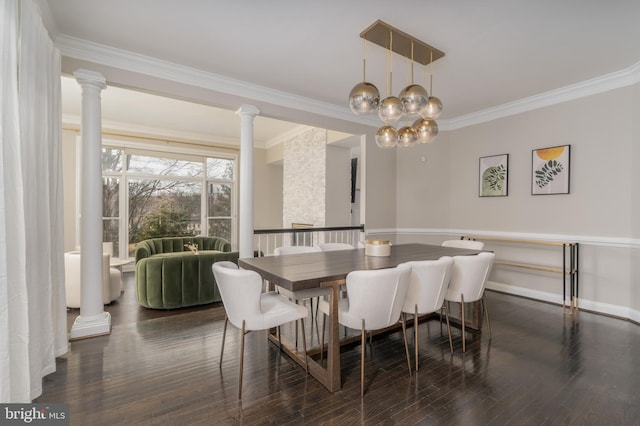 dining room with ornate columns, baseboards, dark wood-style floors, and ornamental molding