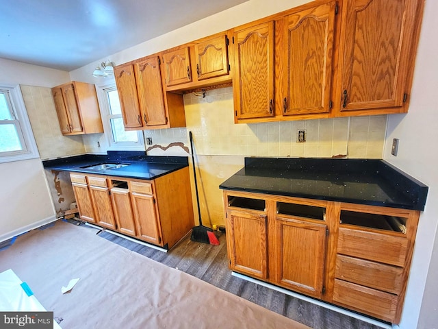 kitchen featuring dark countertops and brown cabinetry