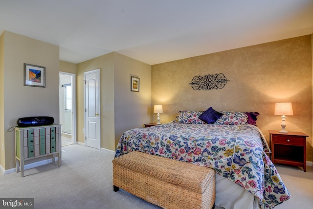 carpeted bedroom featuring baseboards