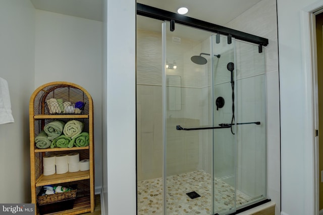 bathroom featuring a shower stall