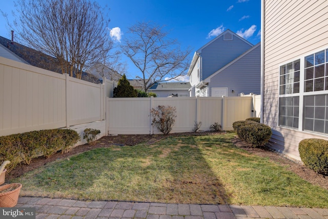 view of yard featuring a fenced backyard