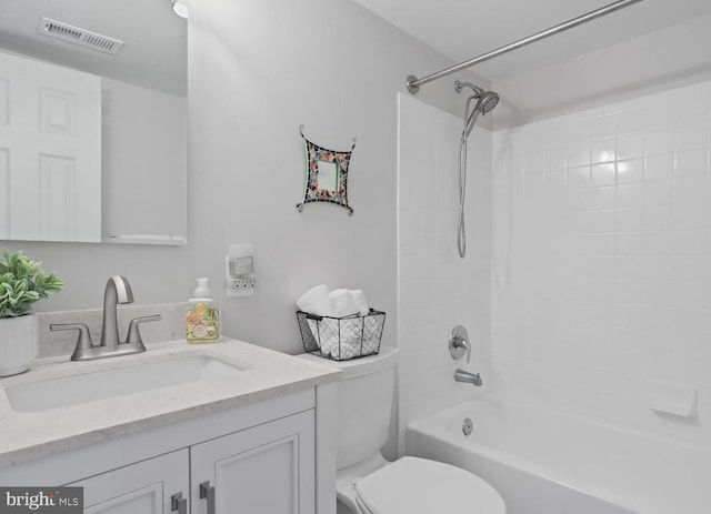 bathroom featuring toilet, bathtub / shower combination, visible vents, and vanity