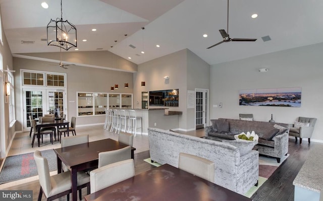 dining area featuring high vaulted ceiling, recessed lighting, ceiling fan, and wood finished floors