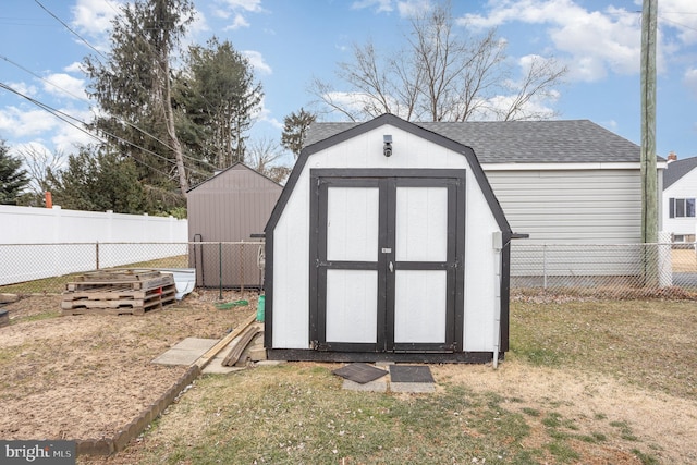 view of shed with a fenced backyard