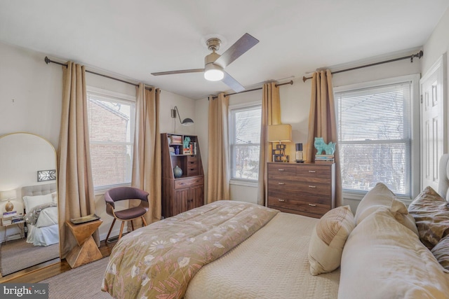 bedroom featuring ceiling fan and wood finished floors