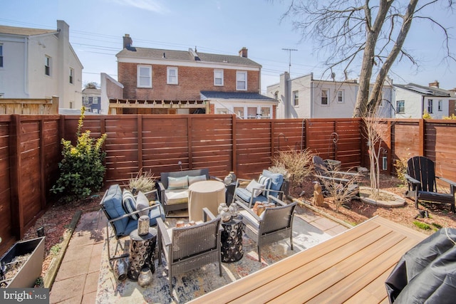 view of patio / terrace with a fenced backyard and an outdoor living space