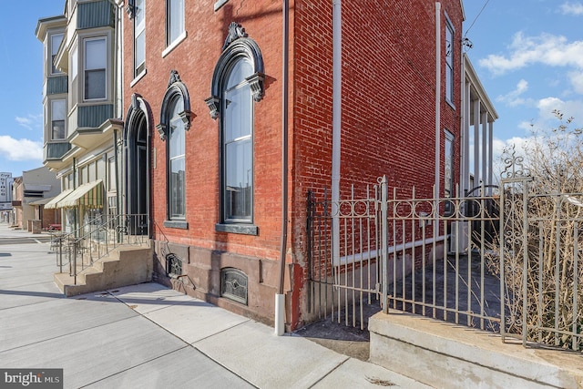 view of property with fence