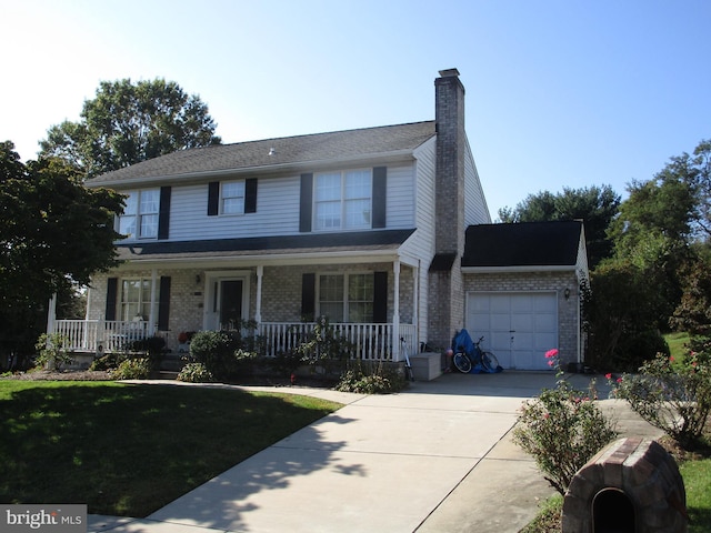 view of front facade featuring a porch, an attached garage, brick siding, concrete driveway, and a chimney