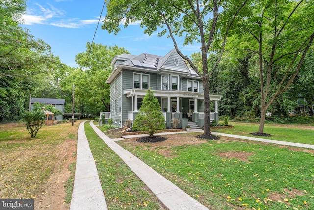 view of front of home featuring a porch and a front yard