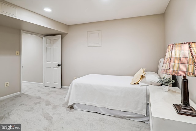 bedroom featuring baseboards, recessed lighting, and light colored carpet