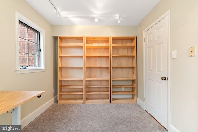 interior space featuring baseboards