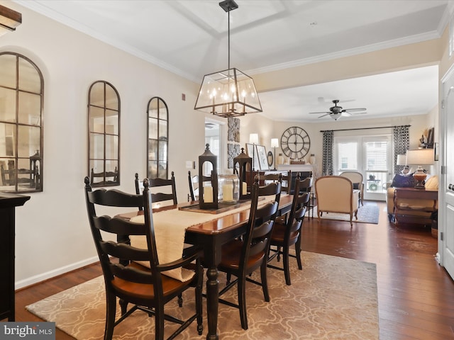 dining space with ceiling fan, baseboards, ornamental molding, and dark wood finished floors