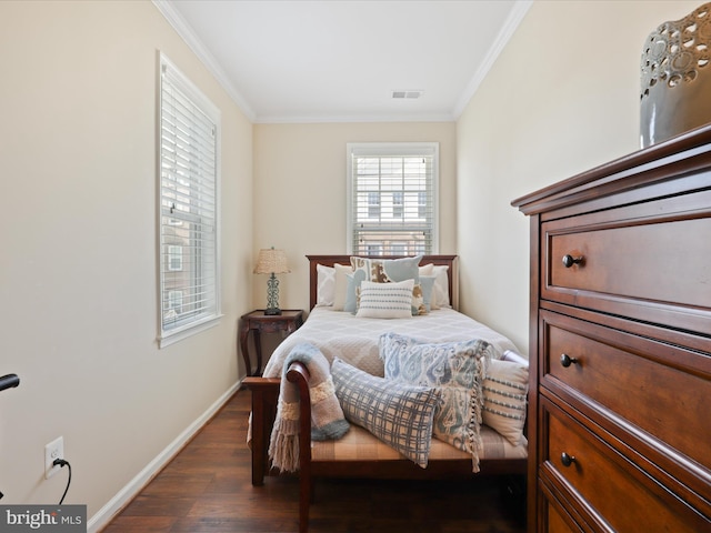 bedroom with ornamental molding, baseboards, visible vents, and dark wood-type flooring