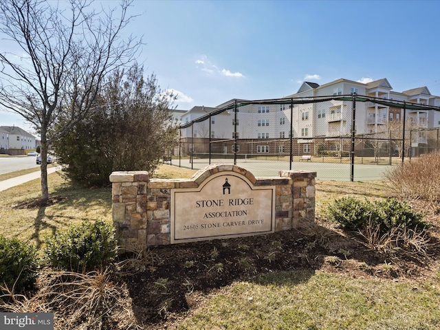 exterior space featuring a residential view and fence