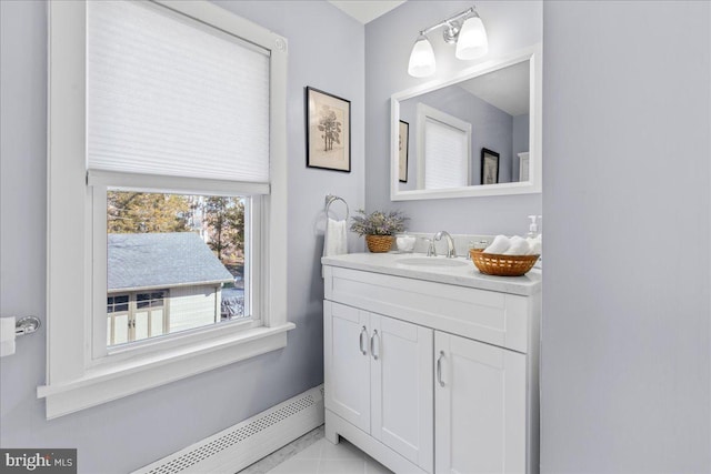 bathroom featuring vanity and baseboard heating