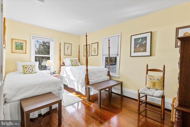 bedroom featuring baseboards and wood finished floors