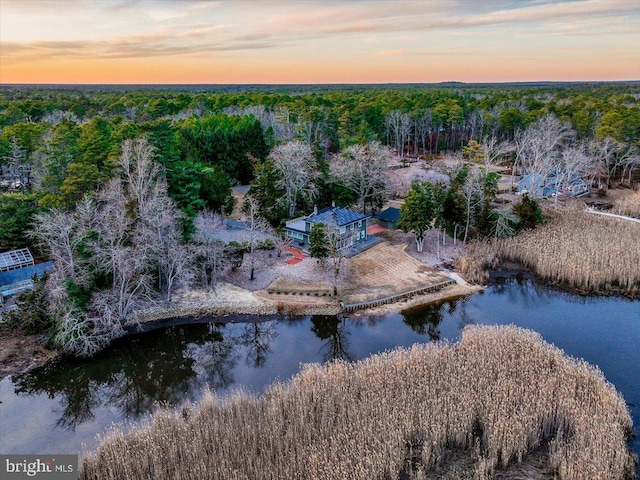 aerial view at dusk with a water view