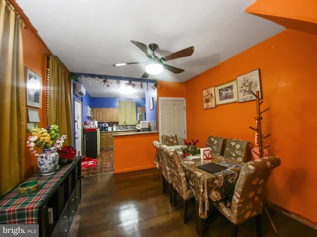 dining area with a wall unit AC and ceiling fan