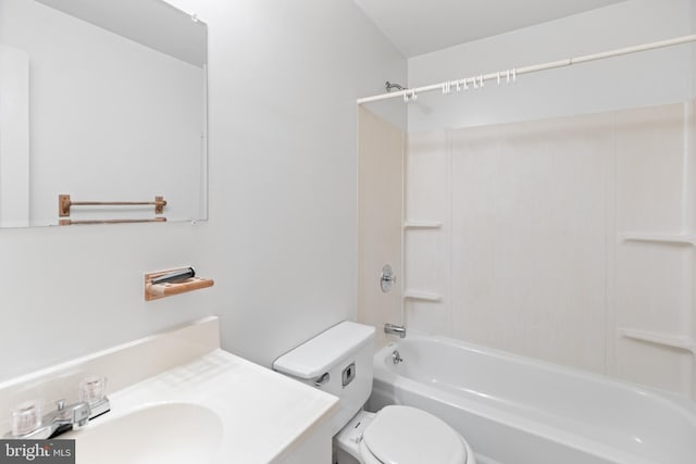 bathroom with toilet, vanity, and washtub / shower combination