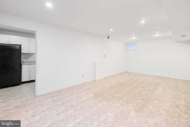 interior space with baseboards and recessed lighting