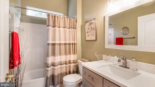 full bathroom featuring shower / tub combo, vanity, and toilet