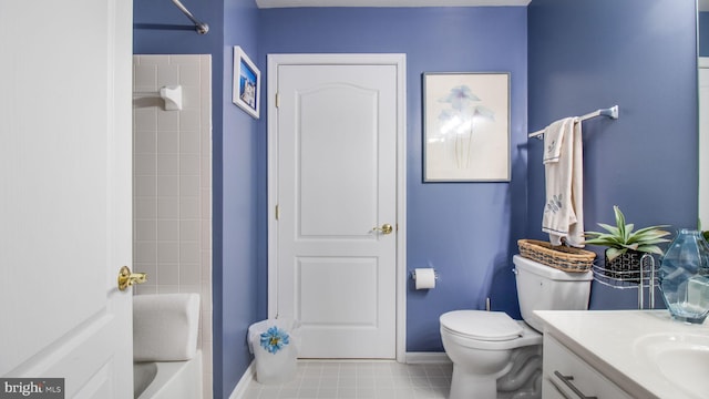 bathroom with shower / bathtub combination, toilet, vanity, baseboards, and tile patterned floors