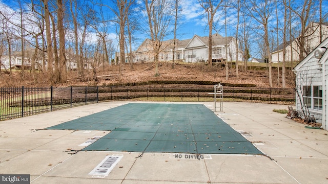 view of pool with a fenced in pool and fence