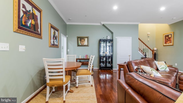 living room with crown molding, recessed lighting, wood finished floors, baseboards, and stairs