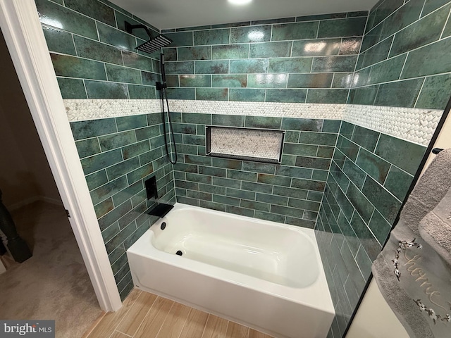 bathroom with tub / shower combination and wood finished floors