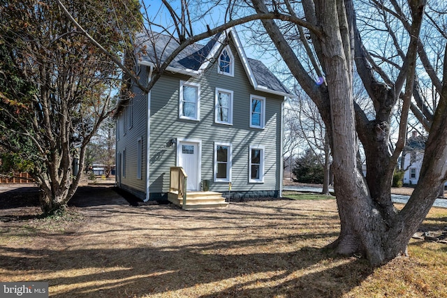 view of front of property with a shingled roof