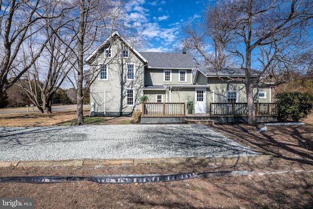 view of front of property featuring a wooden deck