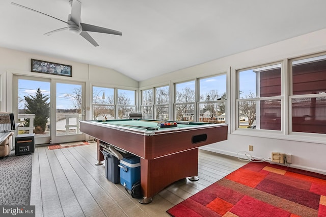 rec room featuring a ceiling fan, light wood-type flooring, vaulted ceiling, and baseboards