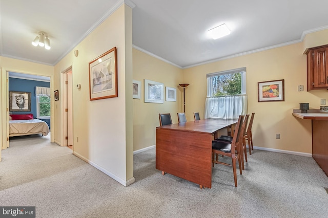 interior space featuring light carpet, crown molding, and baseboards