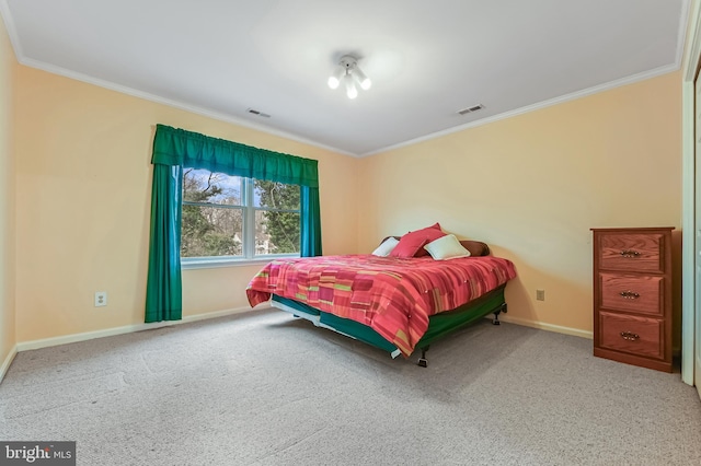 carpeted bedroom featuring visible vents, crown molding, and baseboards