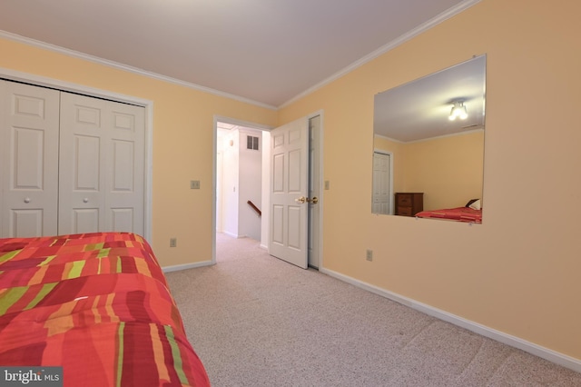 bedroom with carpet floors, ornamental molding, and baseboards