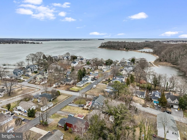 drone / aerial view featuring a water view and a residential view