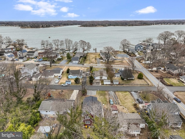 bird's eye view featuring a water view and a residential view