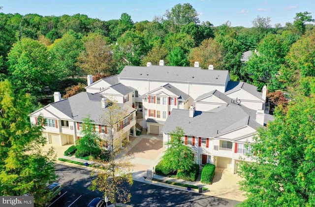 aerial view with a residential view and a view of trees