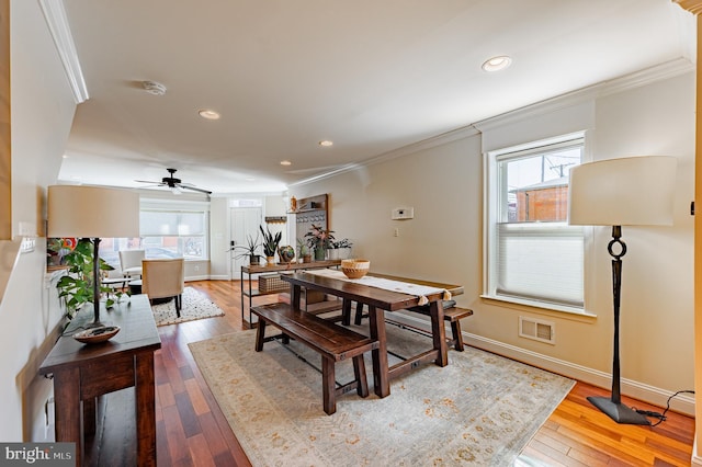 dining space with recessed lighting, visible vents, baseboards, ornamental molding, and hardwood / wood-style floors