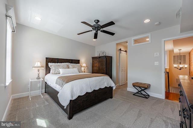 bedroom featuring baseboards, a barn door, recessed lighting, and light colored carpet